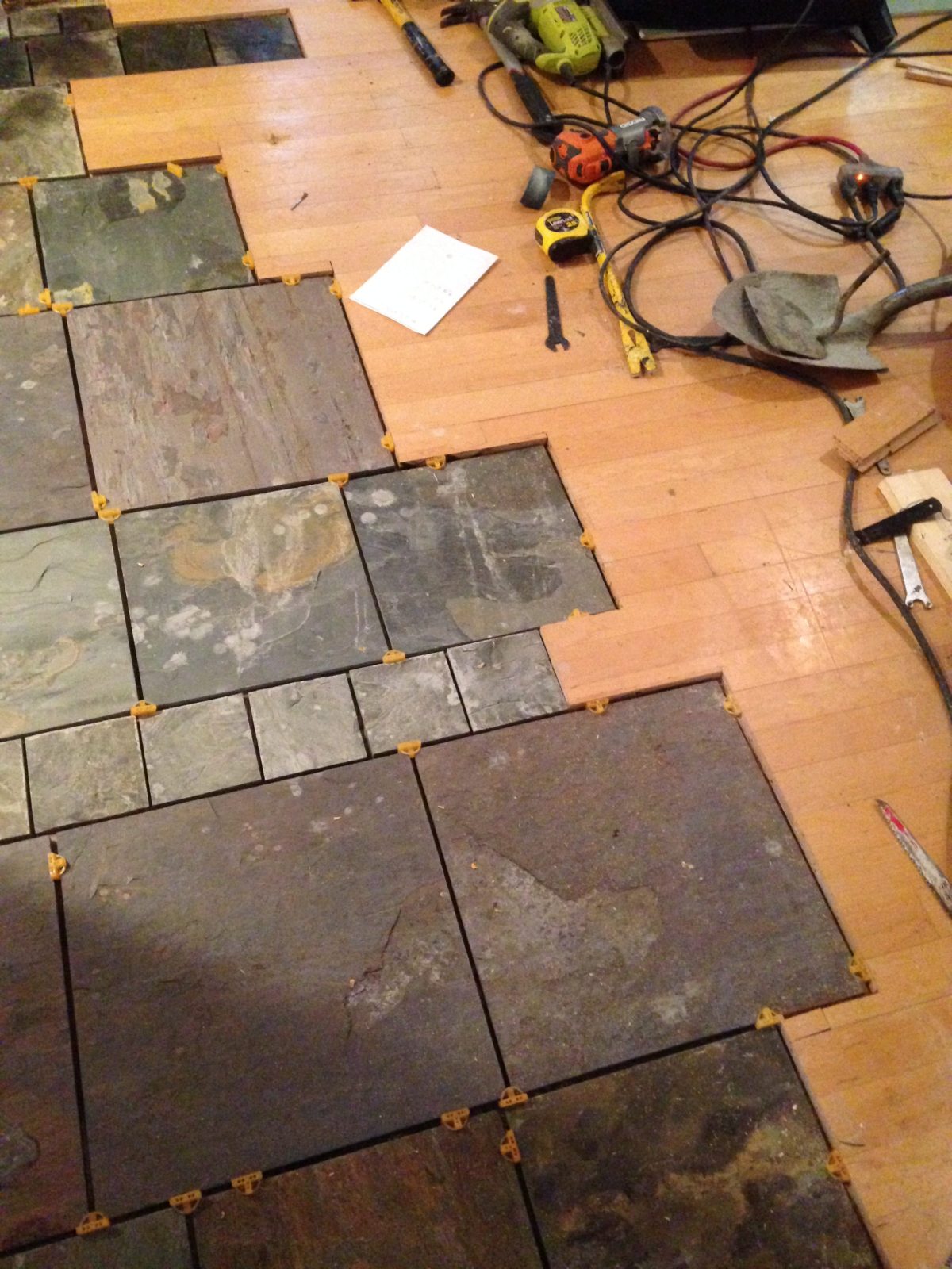artist brandon roth mates custom slate flooring with existing wood flooring