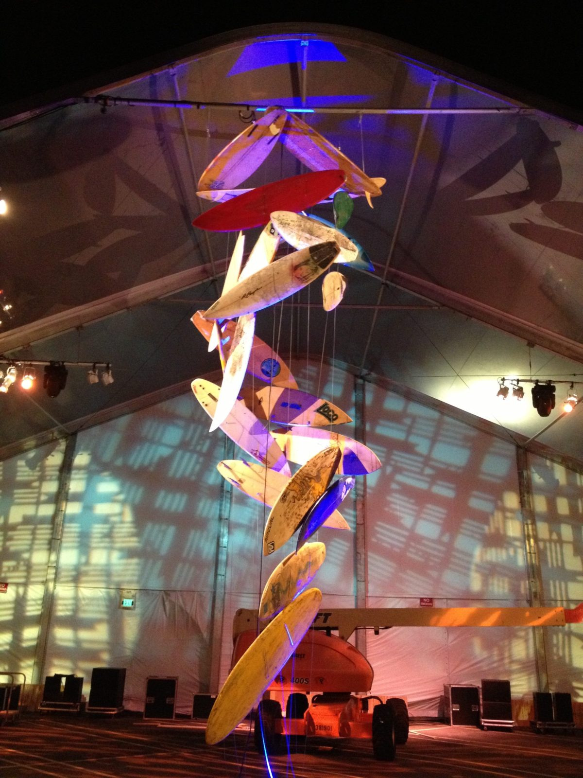 artist brandon roth builds a chandelier made of surfboards with ZOe Productions for corporate client